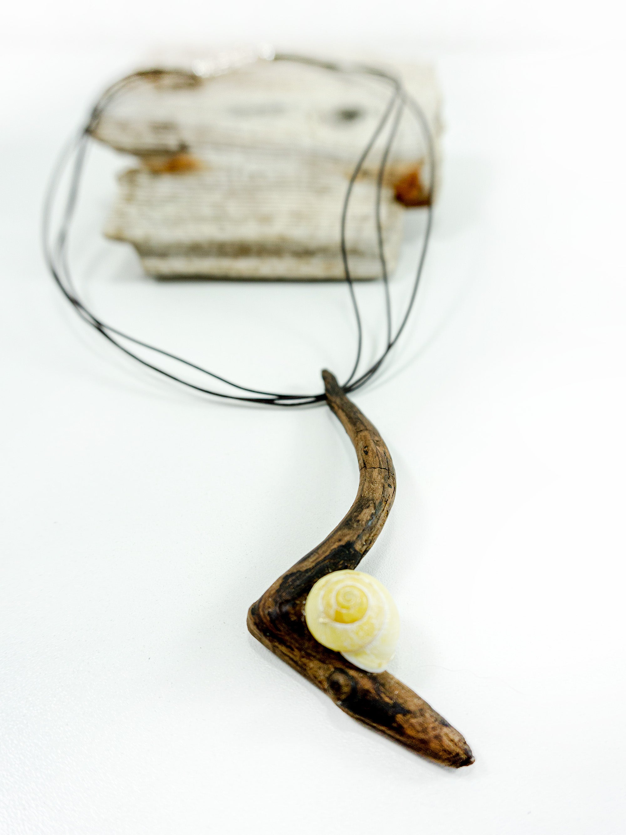 One-of-a-kind DRIFTWOOD NECKLACE 'Borkum' with yellow snail shell